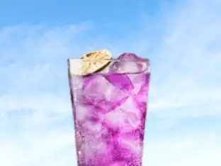 a unique purple haze drink from the first watch restaurant made with purple fruits and herbs.